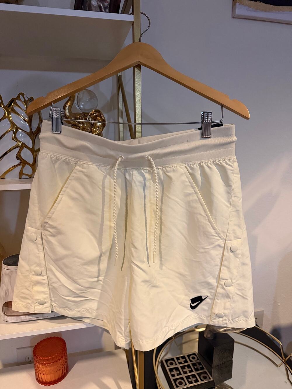 Nike Sportswear woven shorts feature functional side buttons a embroidered logo.